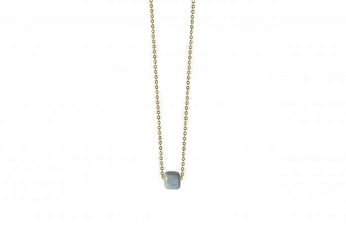 gold necklace with light blue ceramic cube