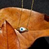 Yellow gold eye necklace